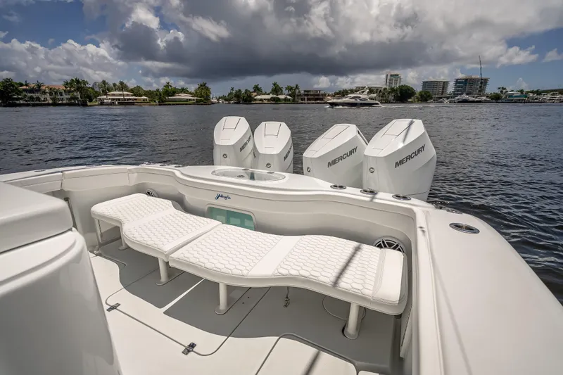 Slide: The Image of 2025 Yellowfin 42 Offshore boat with Mercury engines on a calm waterway. - 48