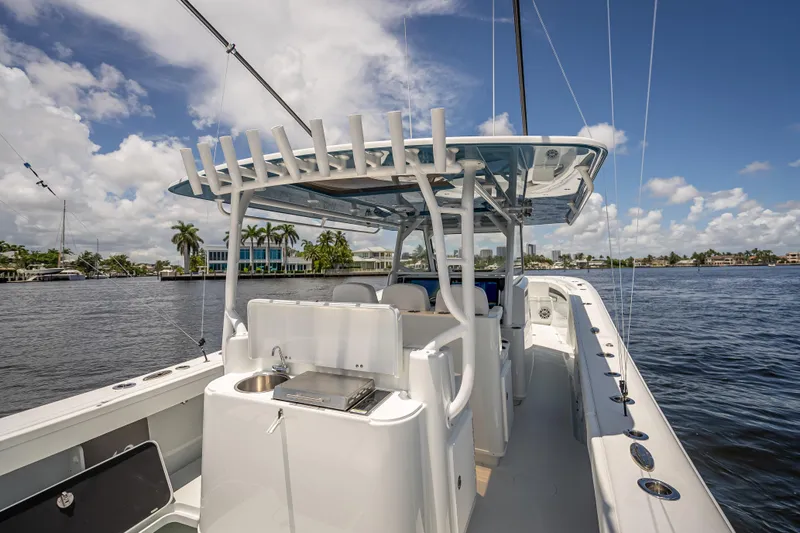 Slide: The Image of 2025 Yellowfin 42 Offshore boat on a sunny day, featuring sleek design and modern amenities. - 59