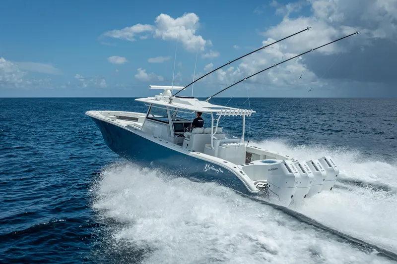 Slide: The Image of 2025 Yellowfin 42 Offshore boat cruising on open ocean under clear skies. - 7