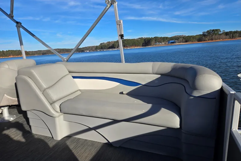 Slide: The Image of 2023 Bennington 22 SSR pontoon boat with comfortable seating, scenic lake view. - 15