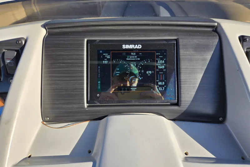 Slide: The Image of Dashboard of 2023 Bennington 22 SSR with Simrad display showing engine data. - 18