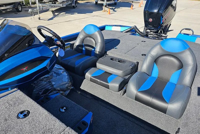 Slide: The Image of 2026 Vexus AVX1880 boat interior with blue and black seating and steering console. - 17