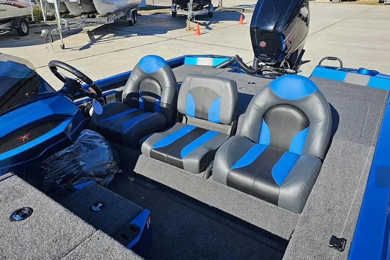 Slide: The Image of 2026 Vexus AVX1880 boat interior with blue and black seating, steering wheel, and motor. - 18