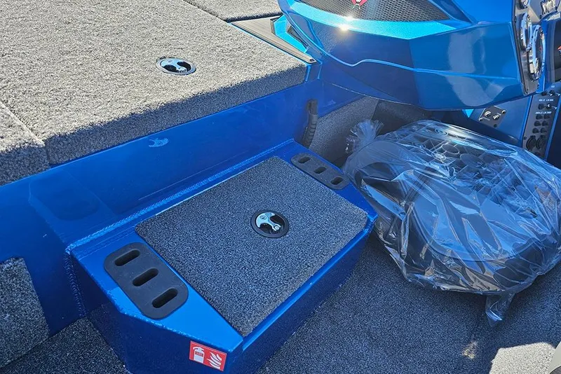 Slide: The Image of 2026 Vexus AVX1880 boat interior with blue accents and carpeted surfaces. - 19