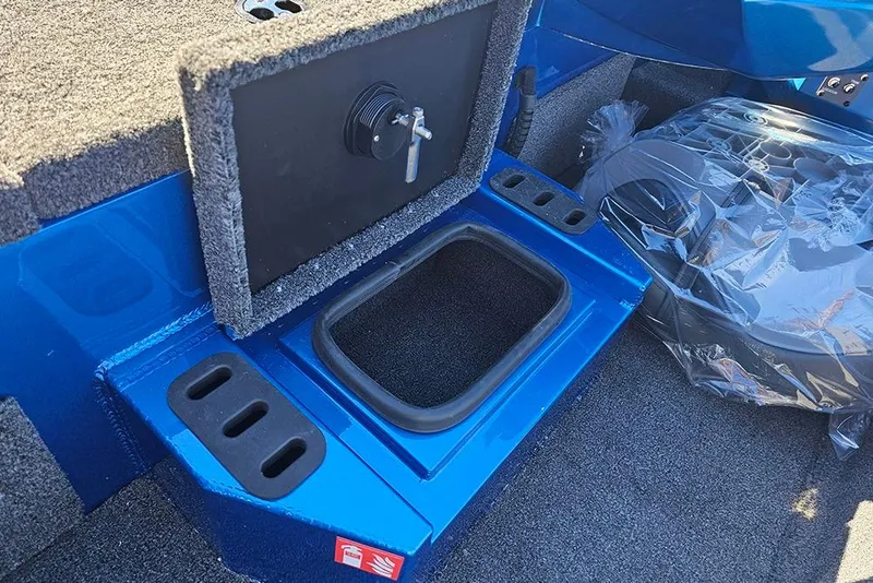 Slide: The Image of 2026 Vexus AVX1880 boat interior with storage compartment and blue finish. - 20