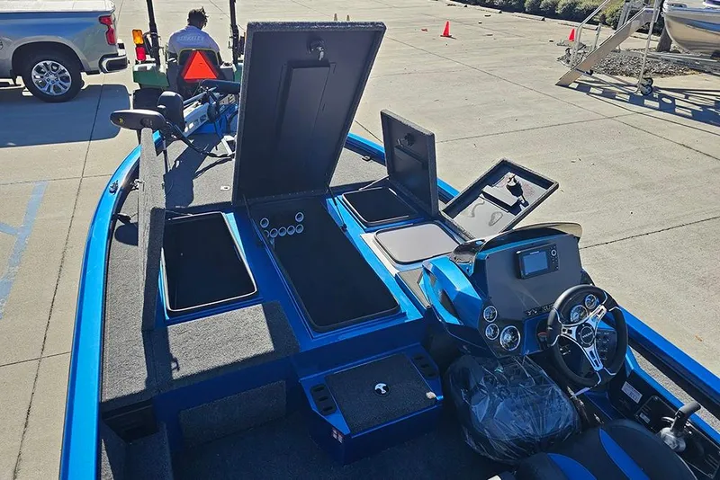 Slide: The Image of 2026 Vexus AVX1880 boat interior with open storage compartments and modern dashboard. - 22