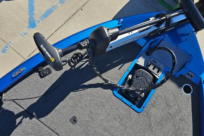 Slide: The Image of 2026 Vexus AVX1880 boat deck with Minn Kota trolling motor and foot pedal. - 26