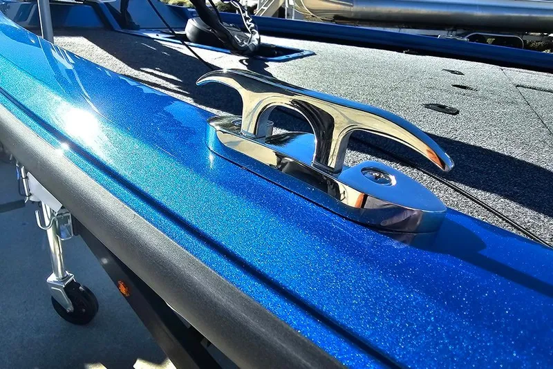 Slide: The Image of 2026 Vexus AVX1880 boat with shiny blue finish and chrome cleat detail. - 28