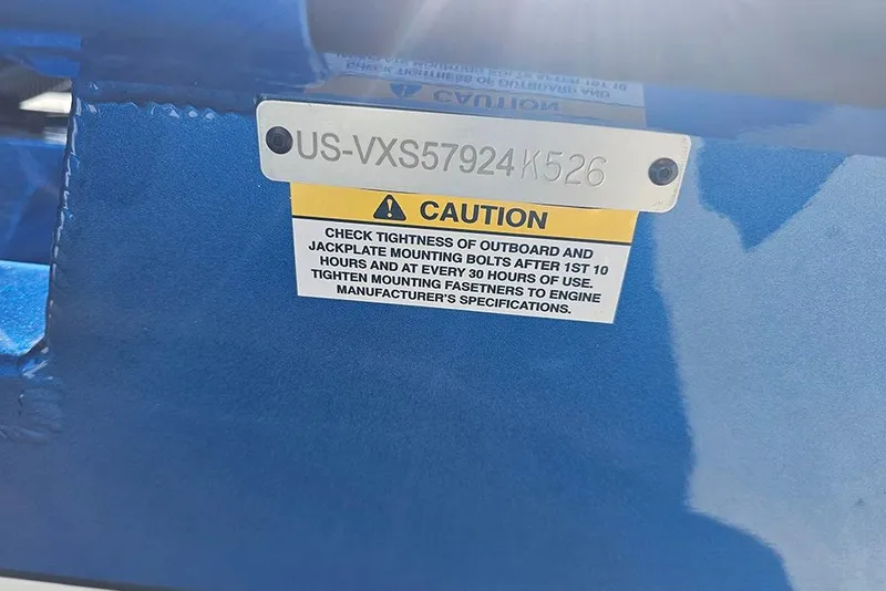 Slide: The Image of 2026 Vexus AVX1880 caution label on blue surface, emphasizing bolt tightness checks. - 30