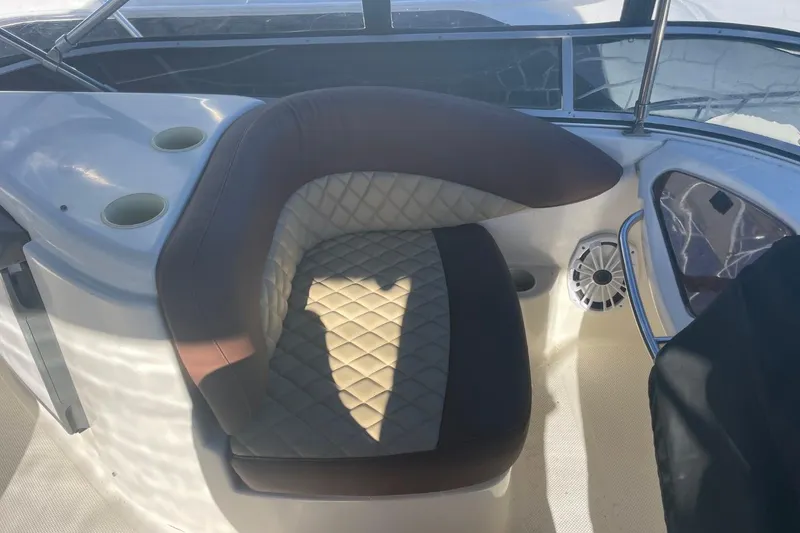 Slide: The Image of 2004 Meridian 459 Motoryacht interior with cushioned seating and cup holders. - 11