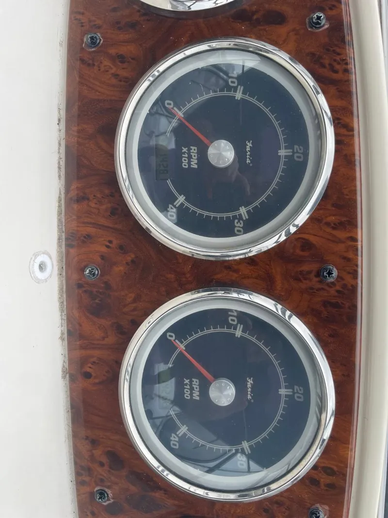 Slide: The Image of Close-up of 2004 Meridian 459 Motoryacht RPM gauges on wood panel. - 20