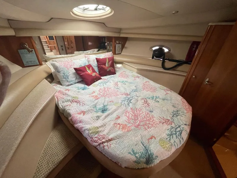 Slide: The Image of Luxurious bedroom interior of 2004 Meridian 459 Motoryacht with colorful bedding and porthole. - 38