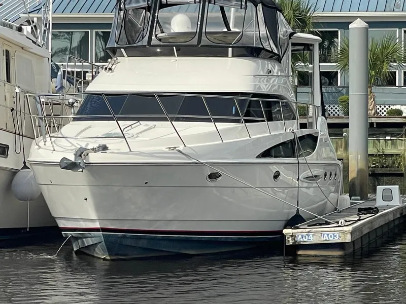 Slide: The Image of 2004 Meridian 459 Motoryacht docked at marina, front view. - 4