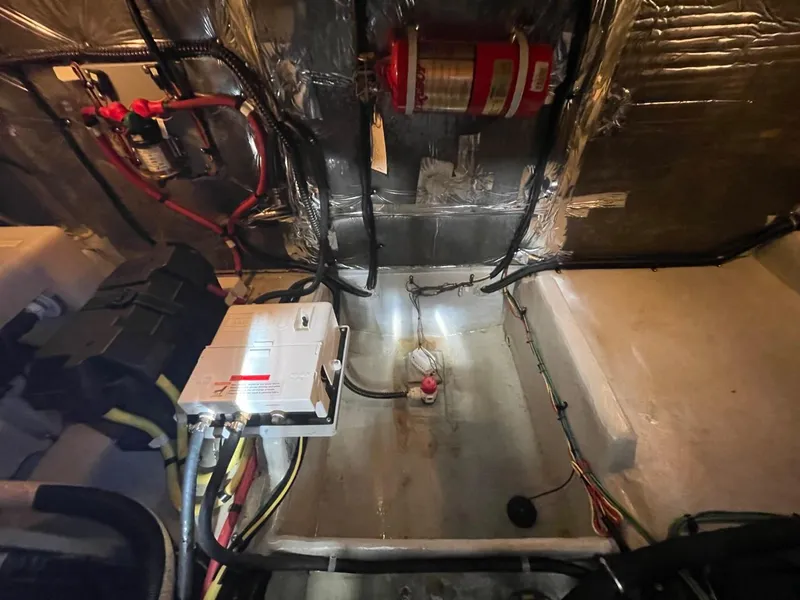 Slide: The Image of Engine room of 2004 Meridian 459 Motoryacht with wiring and fire extinguisher. - 44
