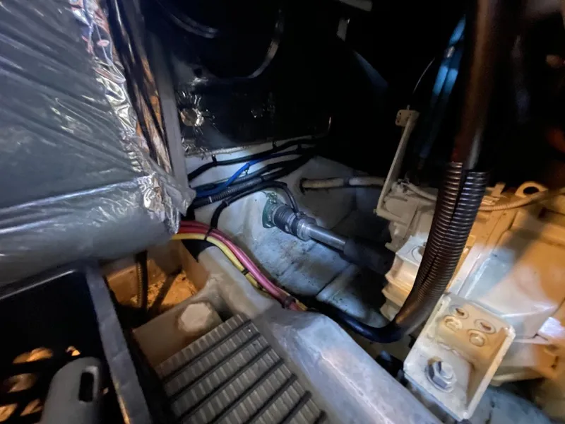 Slide: The Image of Engine compartment of 2004 Meridian 459 Motoryacht, showing mechanical components and wiring. - 47