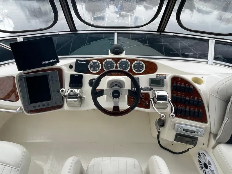 Slide: The Image of 2004 Meridian 459 Motoryacht helm with navigation instruments and steering wheel. - 7