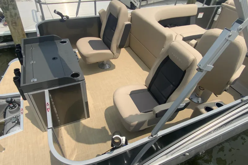 Slide: The Image of 2025 Harris Cruiser 230 interior with beige seating and modern amenities. - 6