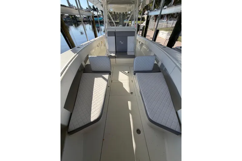 Slide: The Image of 2018 SeaVee 390Z boat interior with cushioned seating and sleek design. - 11