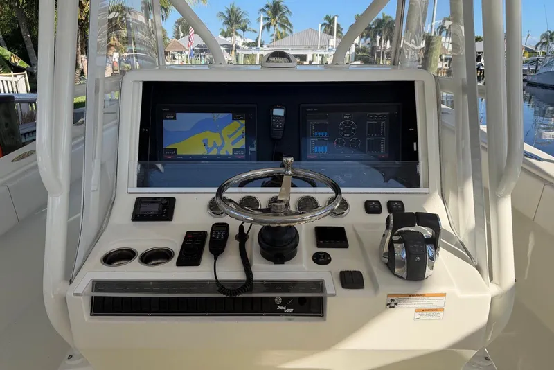 Slide: The Image of 2018 SeaVee 390Z boat dashboard with navigation screens and controls. - 8