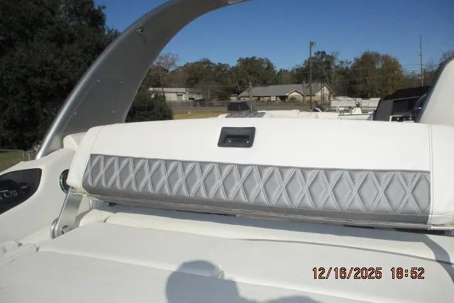 Slide: The Image of 2022 Bennington RX Sport Line boat interior with diamond-stitched seating, outdoors. - 1