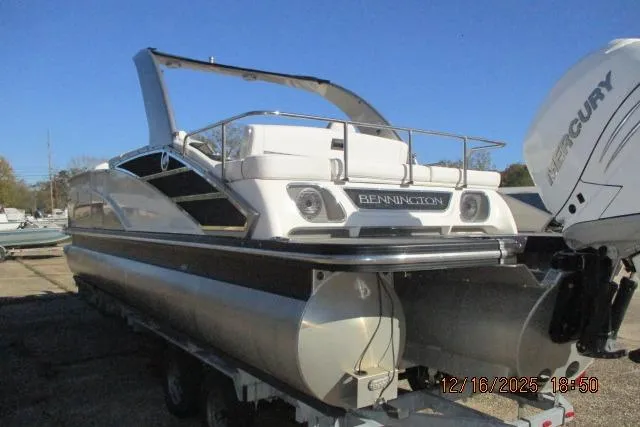 Slide: The Image of 2022 Bennington RX Sport Line pontoon boat with Mercury engine on trailer. - 10