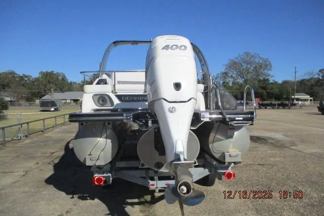 Slide: The Image of 2022 Bennington RX Sport Line boat with powerful outboard motor, parked outdoors. - 11