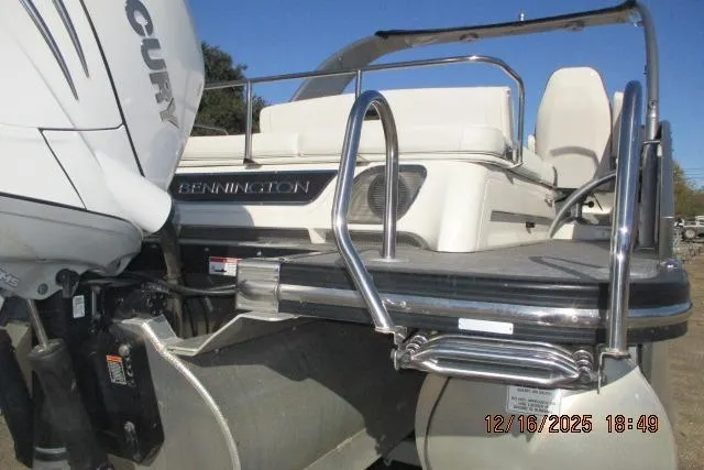 Slide: The Image of 2022 Bennington RX Sport Line boat with Mercury engine and rear ladder. - 12