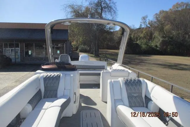 Slide: The Image of 2022 Bennington RX Sport Line boat with luxurious seating and sleek design. - 8