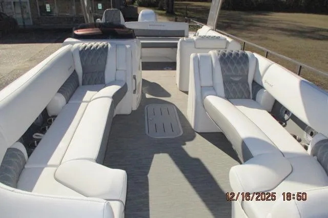 Slide: The Image of 2022 Bennington RX Sport Line boat interior with luxurious white seating and spacious layout. - 9