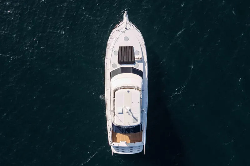Slide: The Image of Aerial view of 2005 Riviera 47 Convertible yacht on open water. - 10