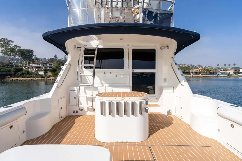 Slide: The Image of 2005 Riviera 47 Convertible yacht deck with scenic waterfront view. - 17