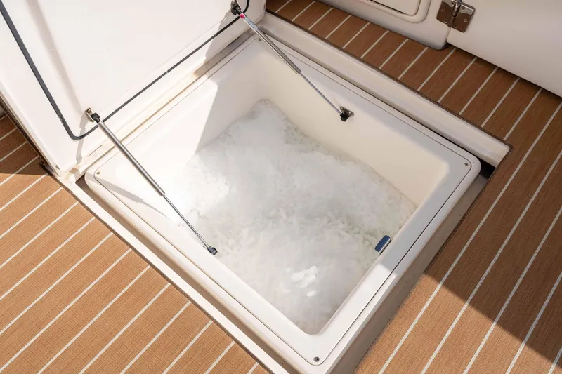 Slide: The Image of Ice-filled storage compartment on 2005 Riviera 47 Convertible yacht deck. - 19
