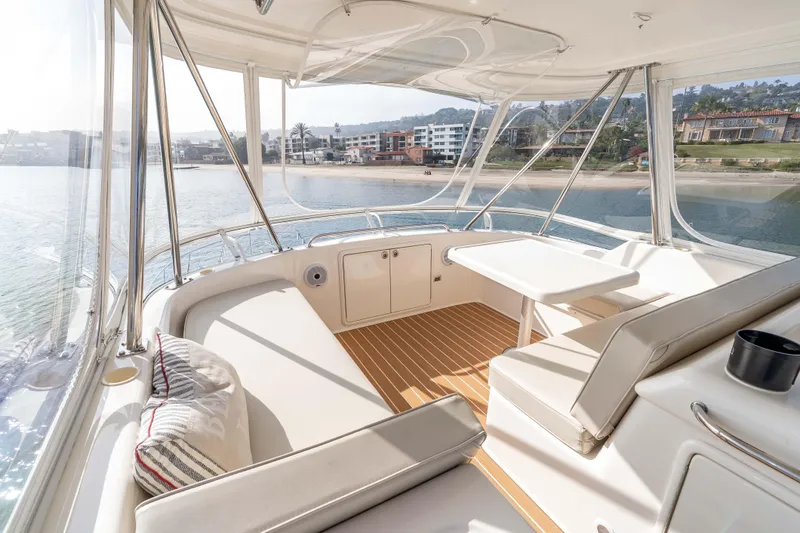 Slide: The Image of Luxurious 2005 Riviera 47 Convertible yacht interior with scenic waterfront view. - 23