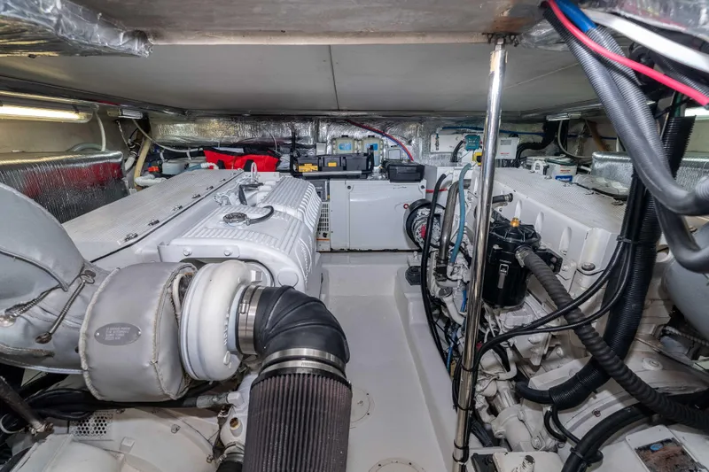 Slide: The Image of Engine room of a 2005 Riviera 47 Convertible yacht, showcasing mechanical components. - 40