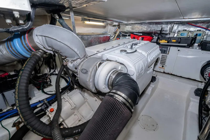 Slide: The Image of Engine room of 2005 Riviera 47 Convertible yacht, showcasing detailed machinery and components. - 41