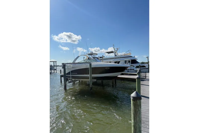 The Image of 2009 Chaparral 290 Signature boat docked on a sunny day. - 1