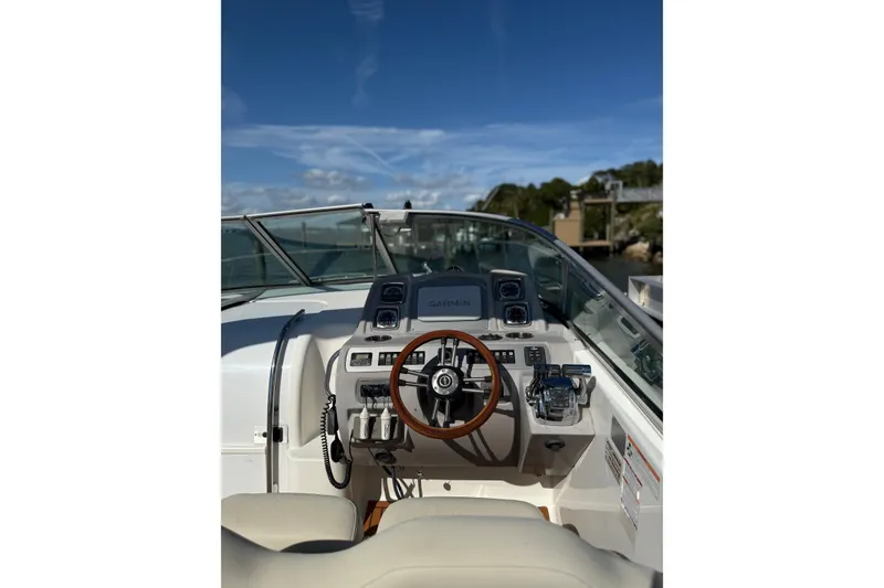 Slide: The Image of 2009 Chaparral 290 Signature boat helm with steering wheel and navigation equipment. - 10