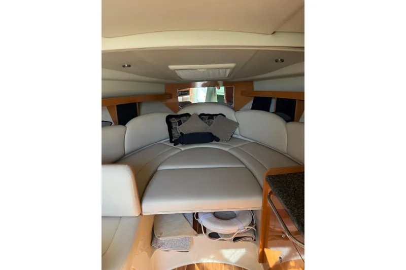 Slide: The Image of 2009 Chaparral 290 Signature cabin interior with plush seating and modern design. - 14