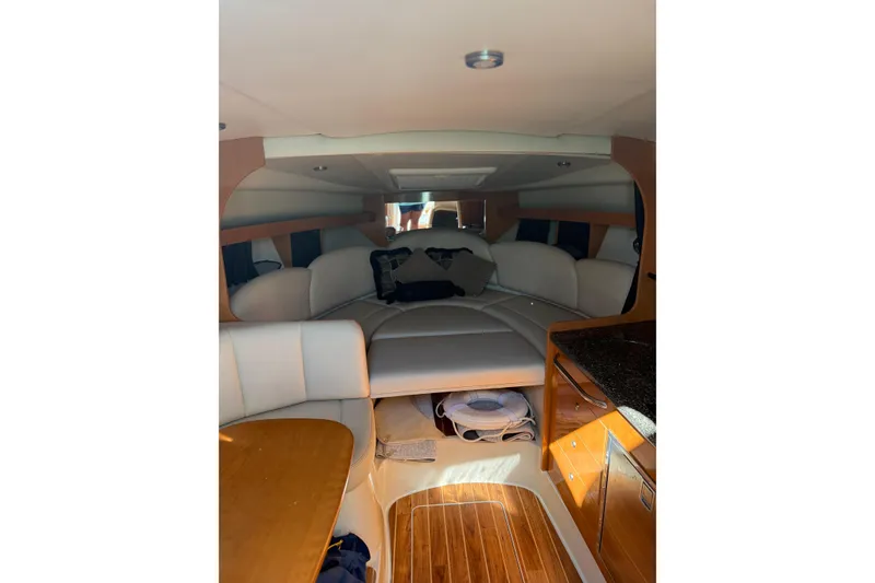 Slide: The Image of Interior of 2009 Chaparral 290 Signature boat with wood and leather finishes. - 15