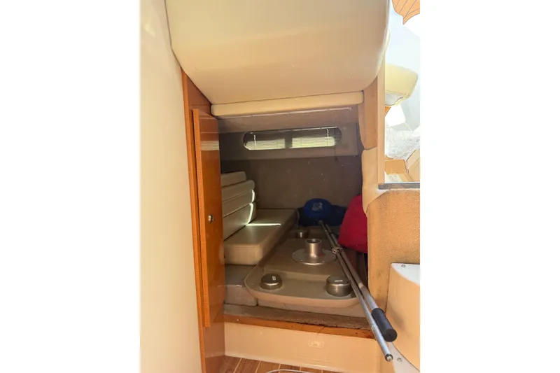 Slide: The Image of 2009 Chaparral 290 Signature cabin interior with seating and storage space. - 17