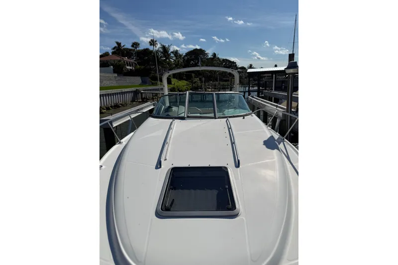 Slide: The Image of 2009 Chaparral 290 Signature boat docked under clear blue sky. - 19