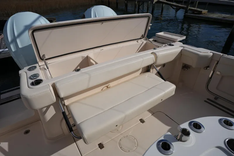 Slide: The Image of 2024 Grady-White Express 330 boat interior with seating and storage compartments. - 35