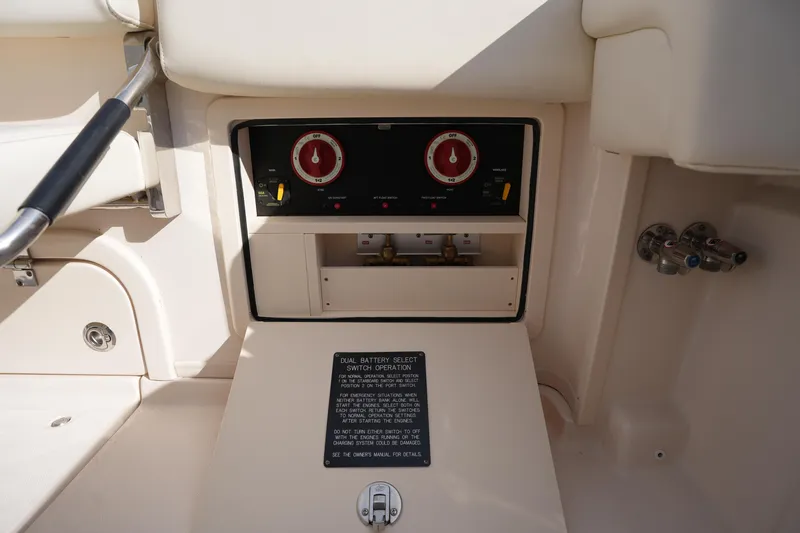 Slide: The Image of 2024 Grady-White Express 330 boat battery control panel and switches. - 36