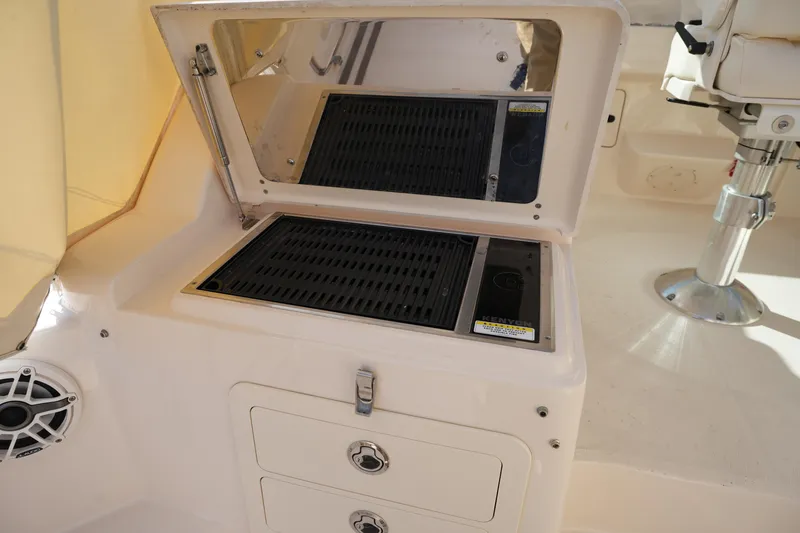 Slide: The Image of 2024 Grady-White Express 330 boat grill and storage area. - 42