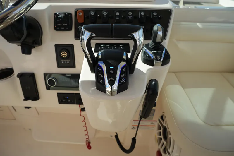 Slide: The Image of 2024 Grady-White Express 330 helm controls with advanced navigation features. - 52