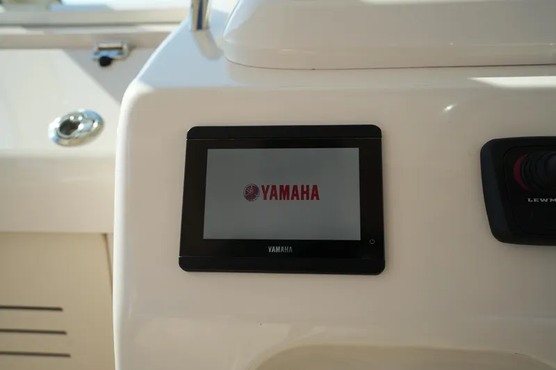 Slide: The Image of 2024 Grady-White Express 330 dashboard featuring Yamaha display screen. - 54