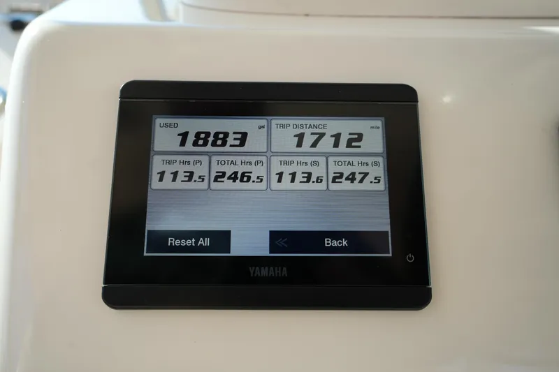 Slide: The Image of Yamaha display on 2024 Grady-White Express 330 showing fuel usage and trip distance. - 55