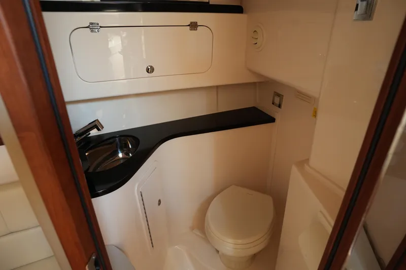 Slide: The Image of 2024 Grady-White Express 330 boat bathroom with sink and toilet. - 68