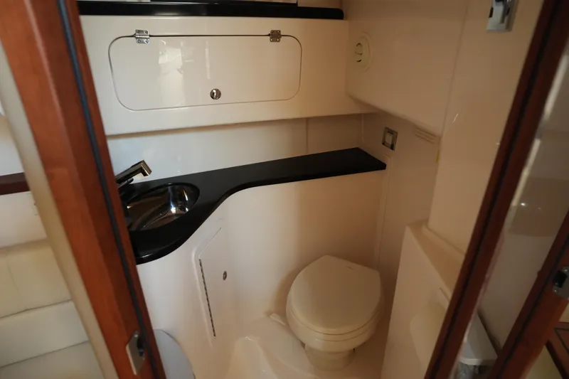 Slide: The Image of 2024 Grady-White Express 330 boat bathroom with sink and toilet. - 69