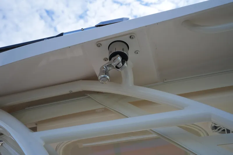 Slide: The Image of 2024 Grady-White Express 330 boat detail with stainless steel fitting under blue sky. - 72